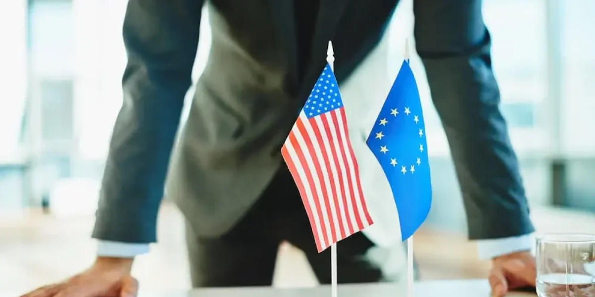 businessman-european-american-flags-1-e1759871660981